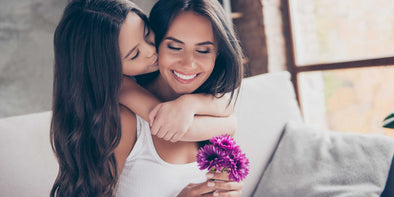 A girl kissing her Mother - Pai Shau Haircare Blog